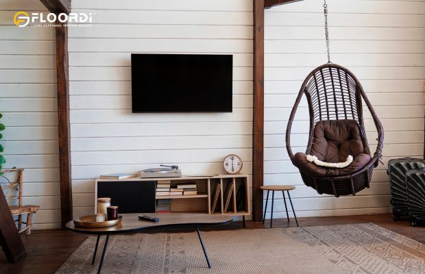 A white, horizontal shiplap wall, a hallmark of farmhouse and coastal styles, creates a relaxed and inviting living room