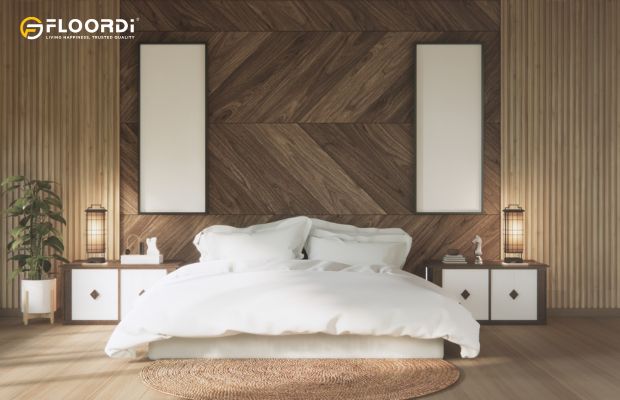 A modern bedroom headboard wall made from reclaimed wood arranged in a striking chevron pattern