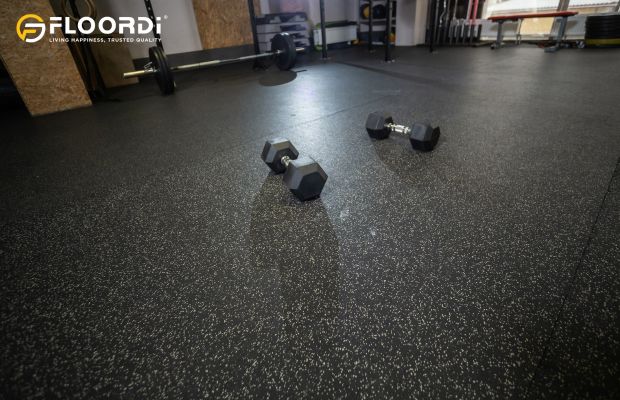 Black speckled rubber flooring in functional gym space